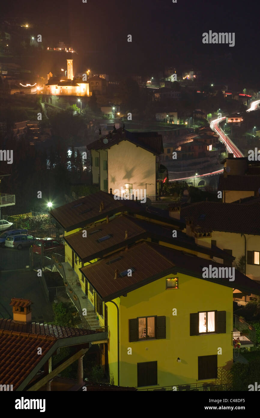Twilight Argegno with Chiesa di S. Sisinnio from Via Schignano at Argegno on Lake Como. Lombardy. Italy. Stock Photo