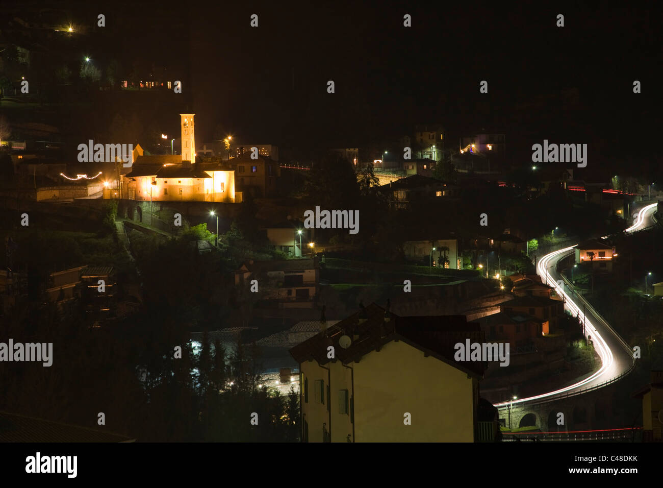 Night Argegno with Chiesa di S. Sisinnio from Via Schignano at Argegno on Lake Como. Lombardy. Italy. Stock Photo