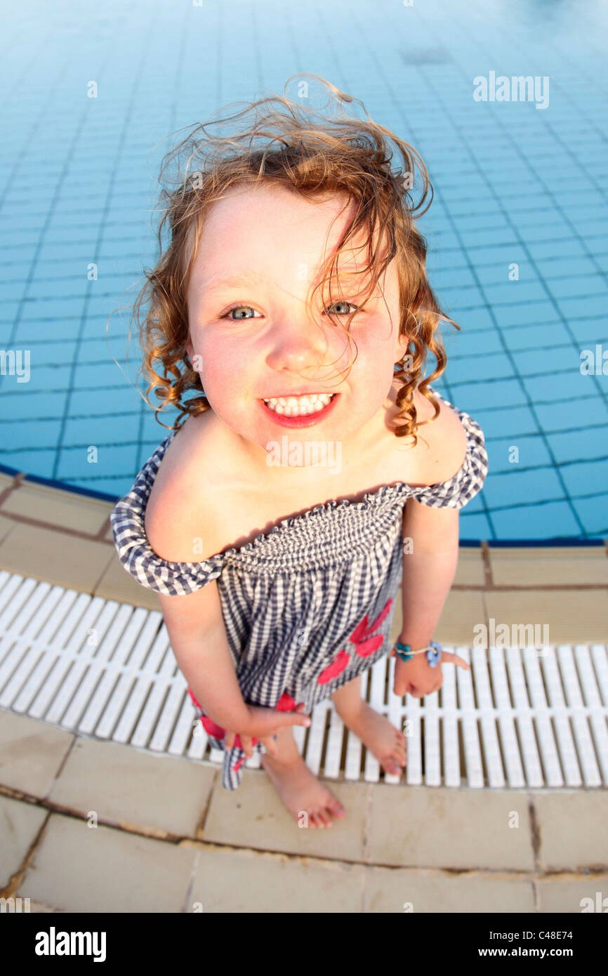 Model released happy, smiling child, a four year old girl playing