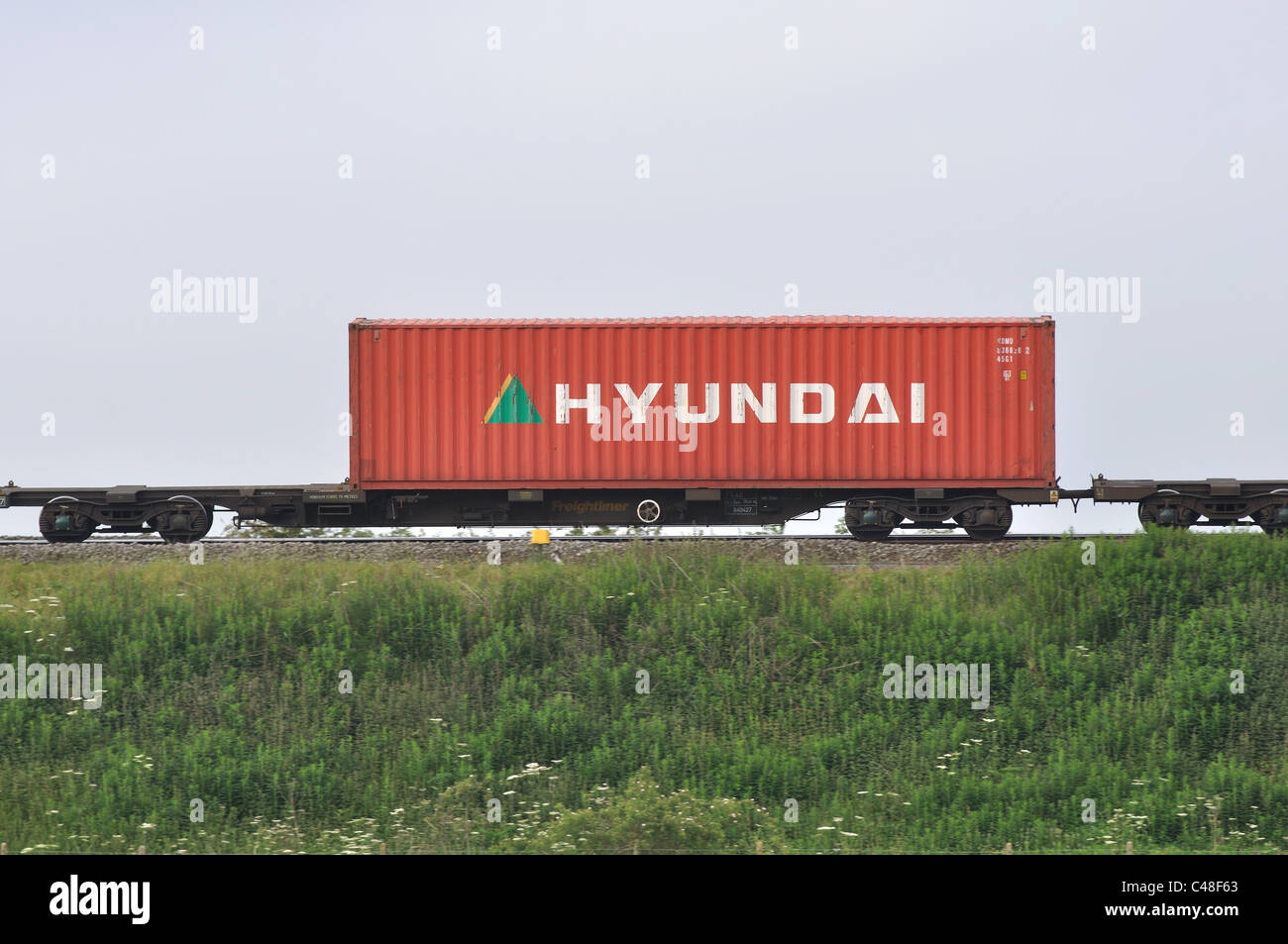Hyundai shipping container on train, UK Stock Photo Alamy