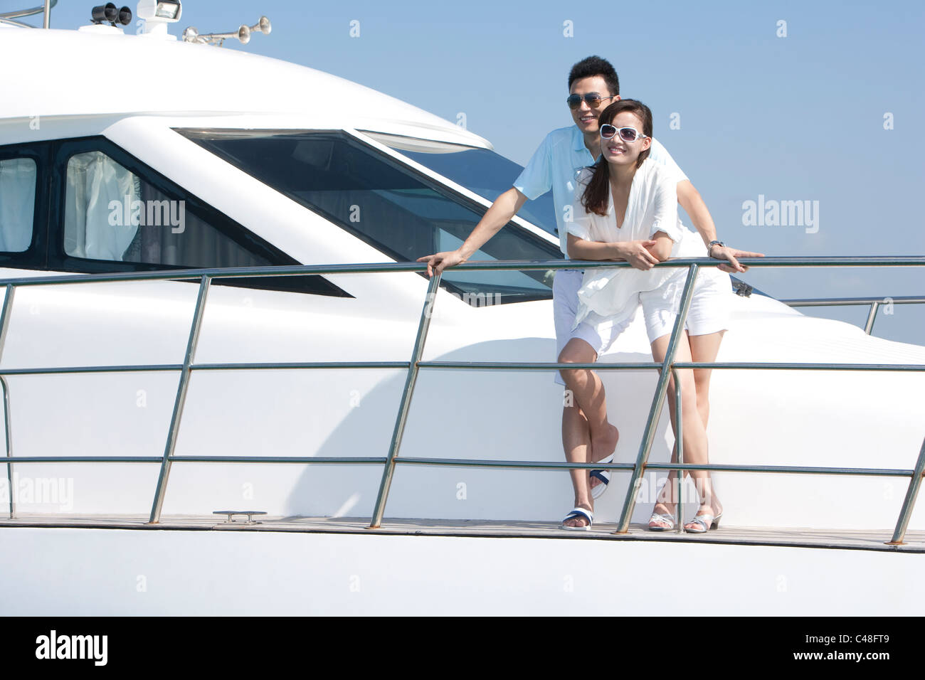 Happy Couple on a Yacht Stock Photo