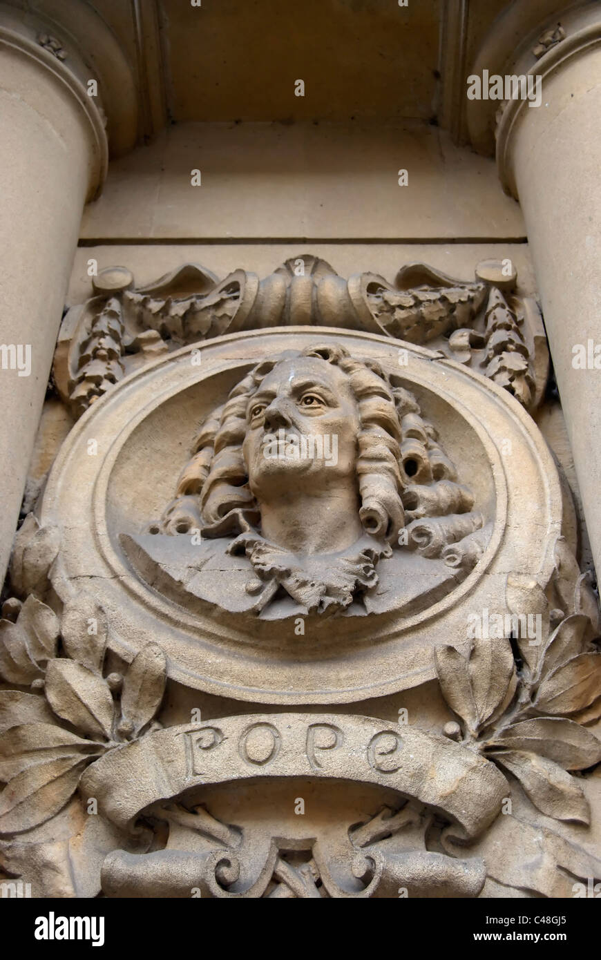 niche bust of the poet and satirist alexander pope on exterior of twickenham library, twickenham, middlesex, england Stock Photo