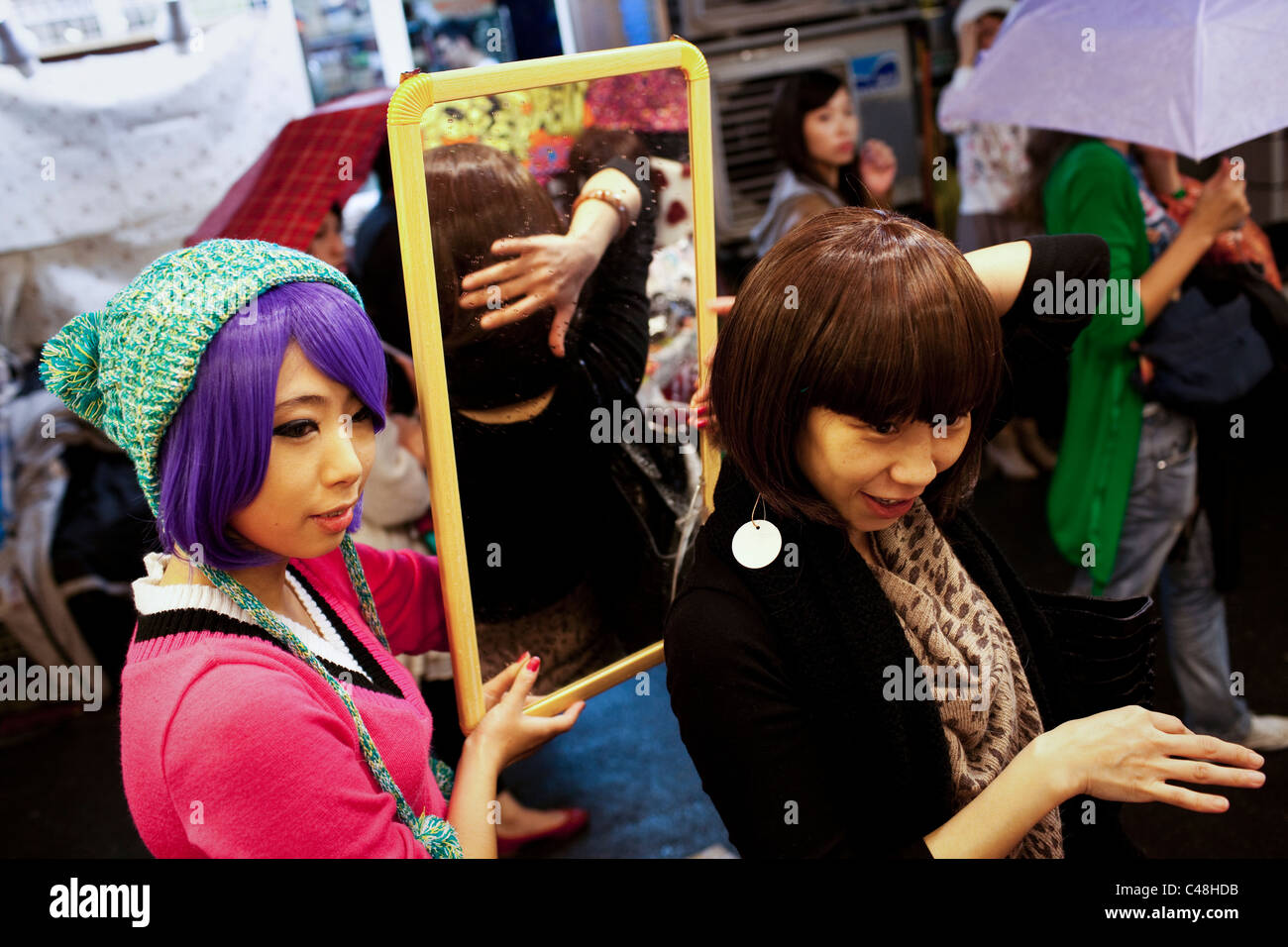 Wig shopping at the Shida Road Night Market, Taipei, Taiwan, November 5, 2010. Stock Photo