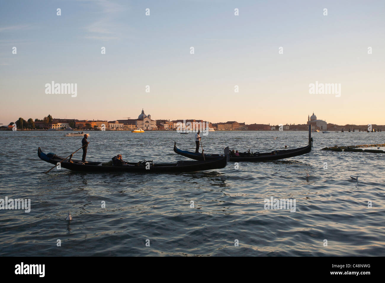 Two gondolas at sunrise in Venice, Italy Stock Photo - Alamy