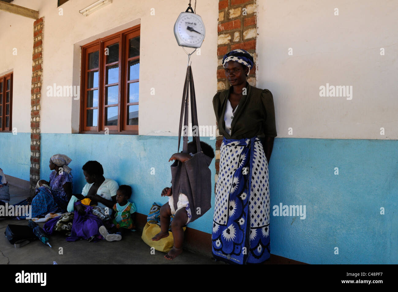 A child is weighed at a medical Center in Africa Stock Photo
