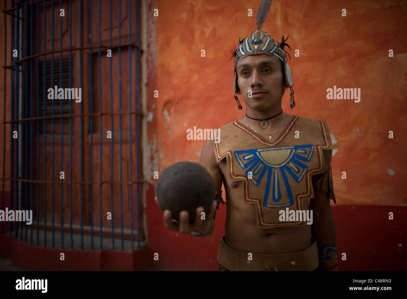 A Mayan ball player holds up the ball made of hule in Chapab village in Yucatan state in Mexico's Yucatan peninsula Stock Photo