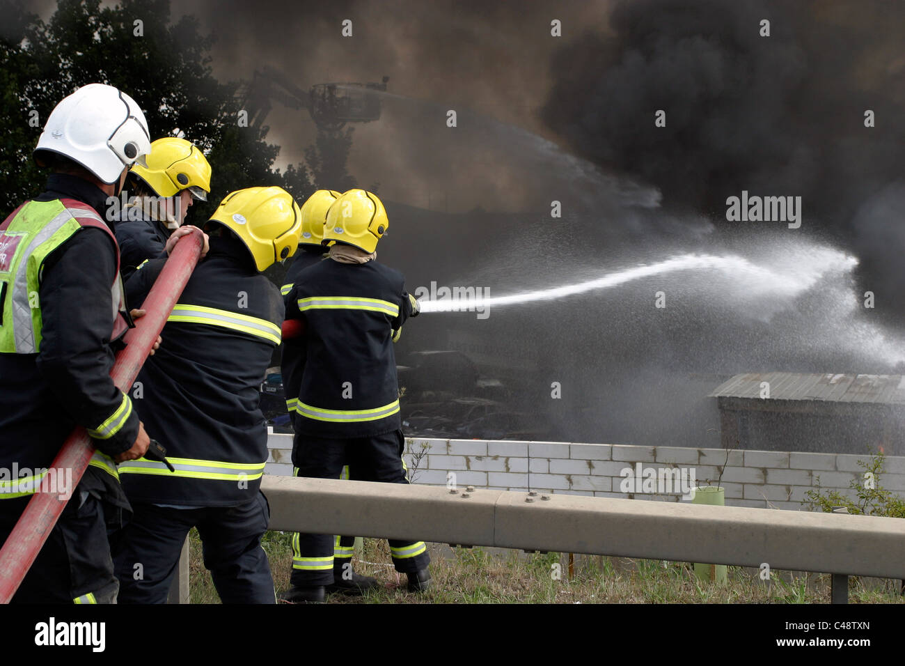 Firefighters tackle a large blaze at a scrapyard Stock Photo - Alamy