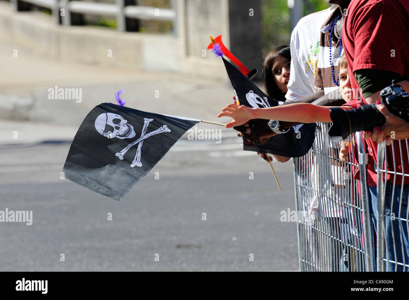 Crossbones and Skull flags waving during annual Tampa Florida Gasparilla Pirate Festival Parade Stock Photo