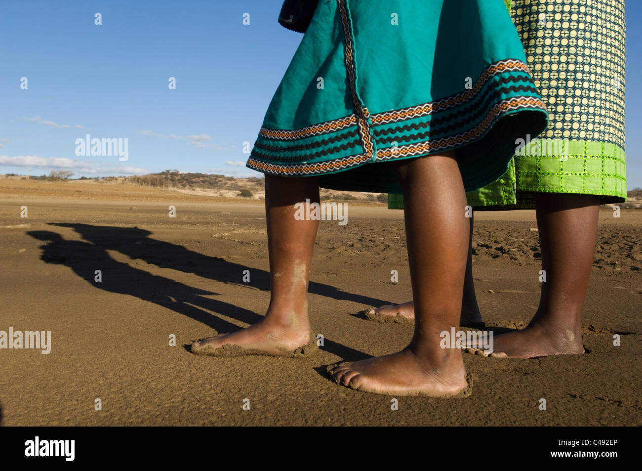 Mother and child walking barefoot on the lake shore, KwaZulu-Natal, South Africa Stock Photo
