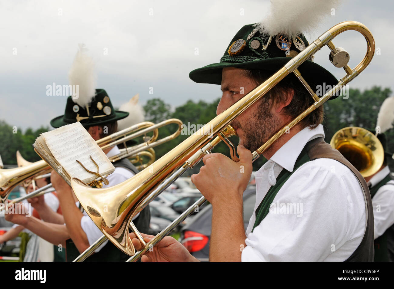 musicians in typical bavarian traditional clothes at folk festival in Bavaria, Germany Stock Photo