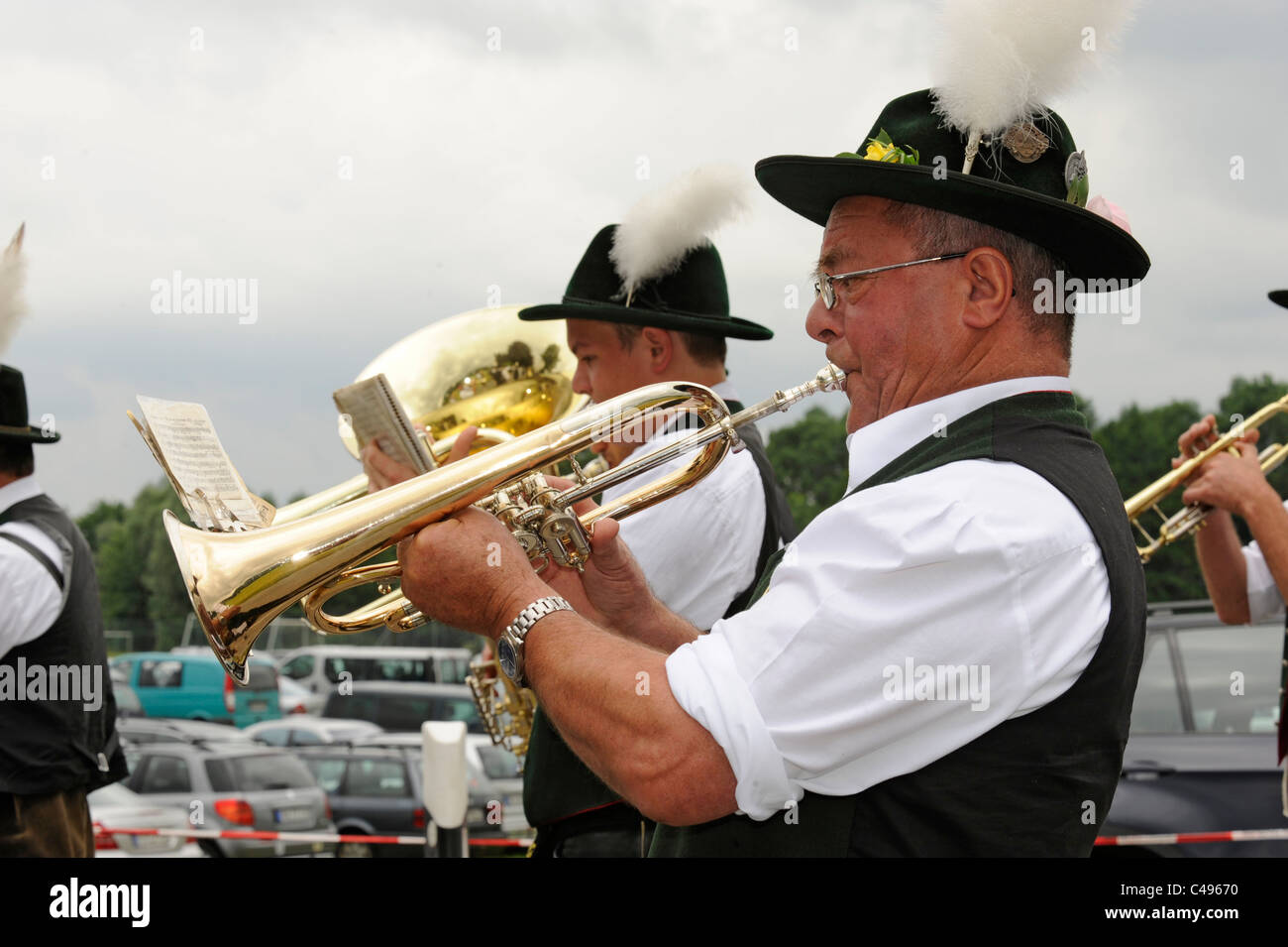 musicians in typical bavarian traditional clothes at folk festival in Bavaria, Germany Stock Photo