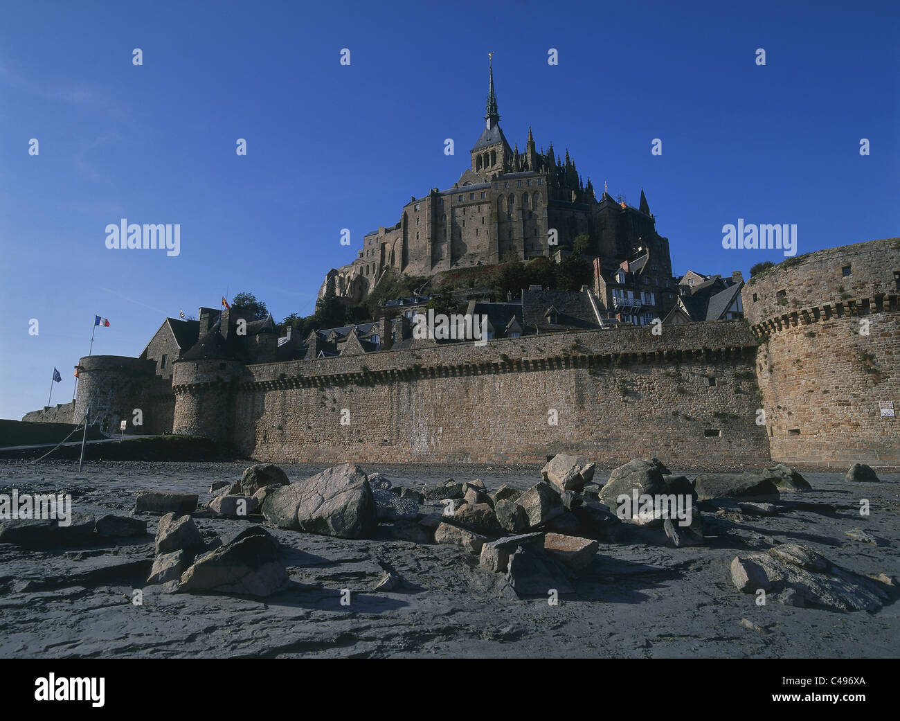 Photograph of a castle on a rock during low-tide in Normandy Stock Photo