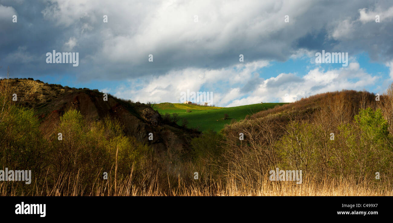 Italian hills landscape under moody sky Stock Photo