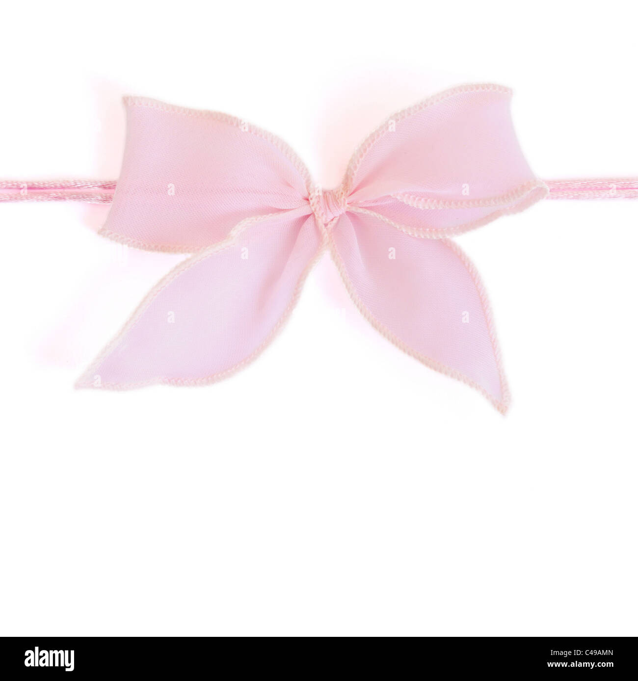 Pink bow isolated on white background Stock Photo - Alamy