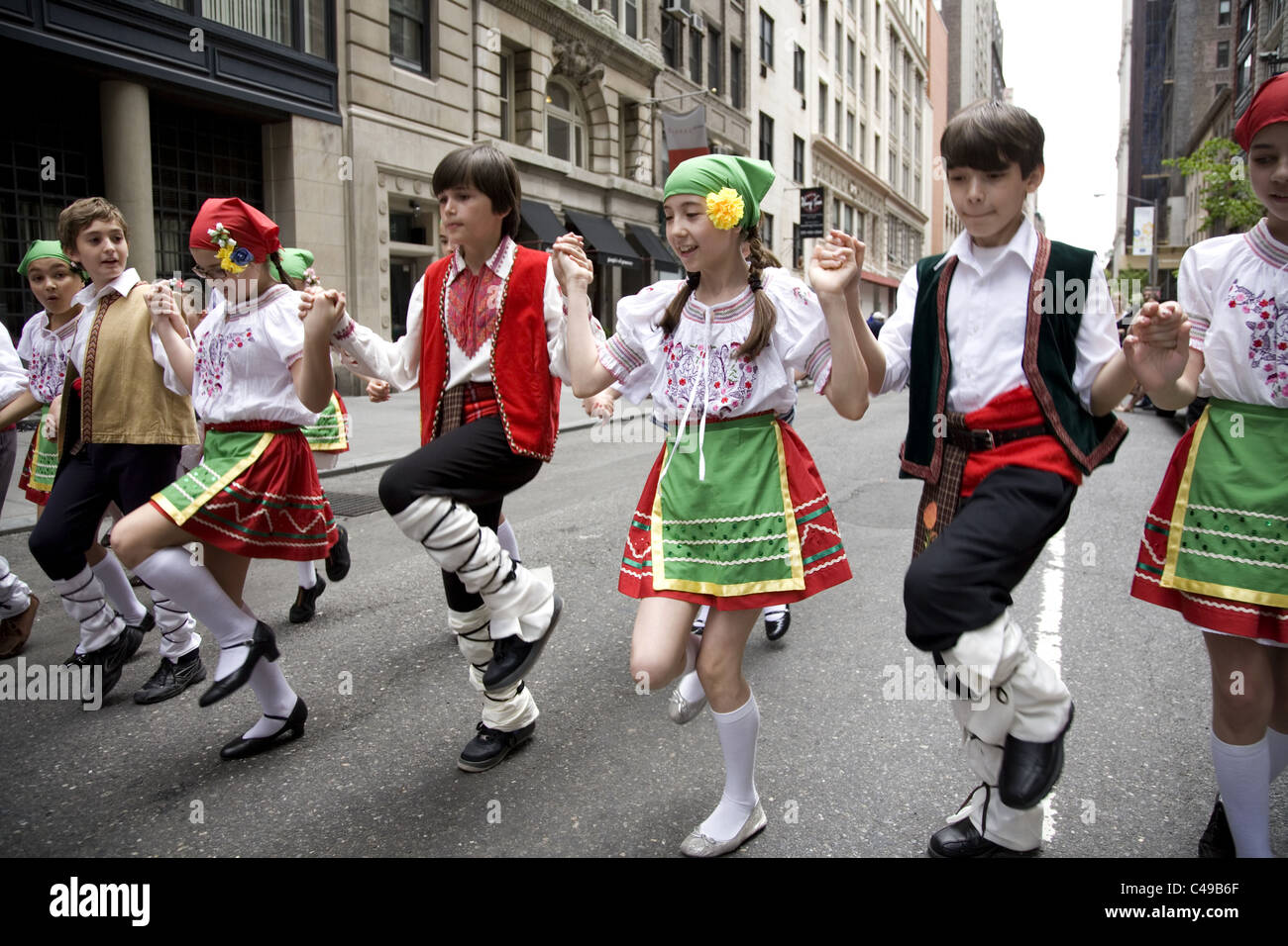 Annual New York City Dance Parade along Broadway in New York City. Young Bulgarian folk dancers Stock Photo