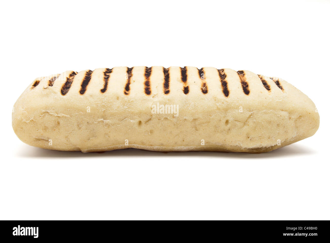 Single toasted panini from low perspective isolated on white. Stock Photo