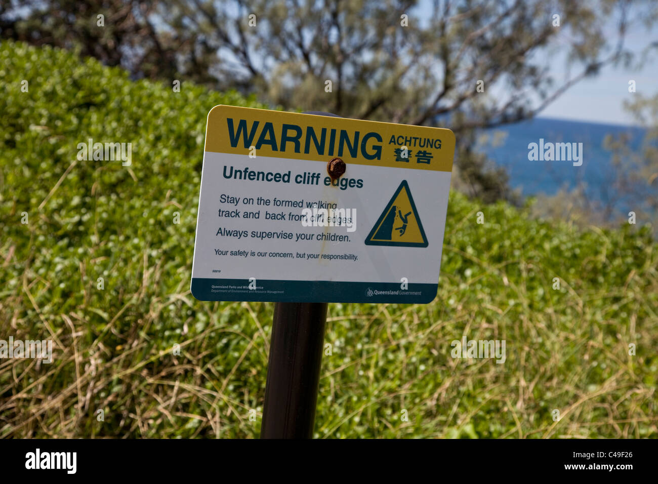 Warning Sign Achtung Beware of unfenced cliff edges Stock Photo