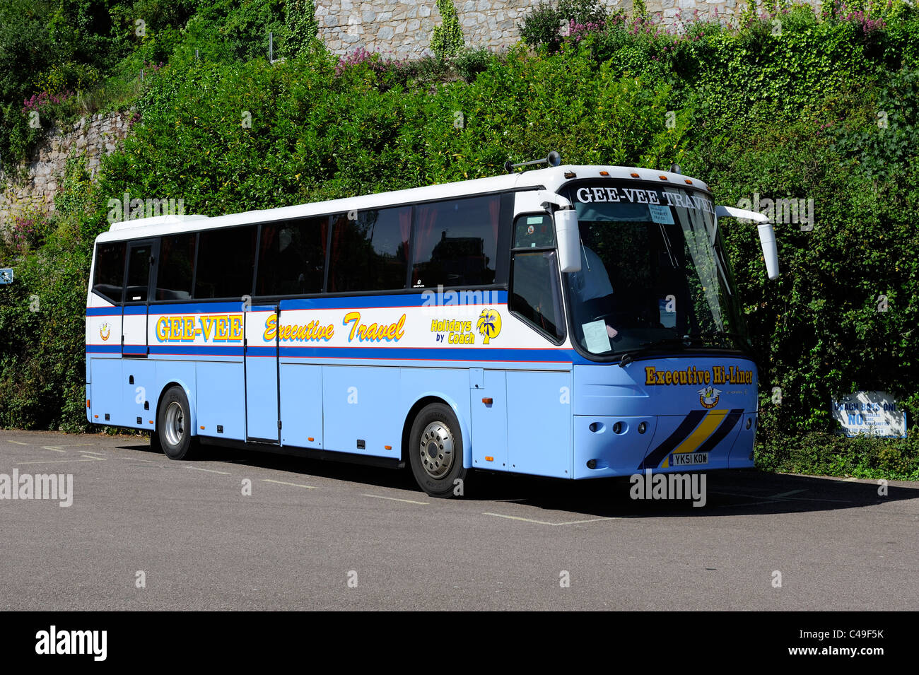 executive travel coach parked up in Brixham Devon england uk belonging to gee vee travel coach holidays of Barnsley Stock Photo