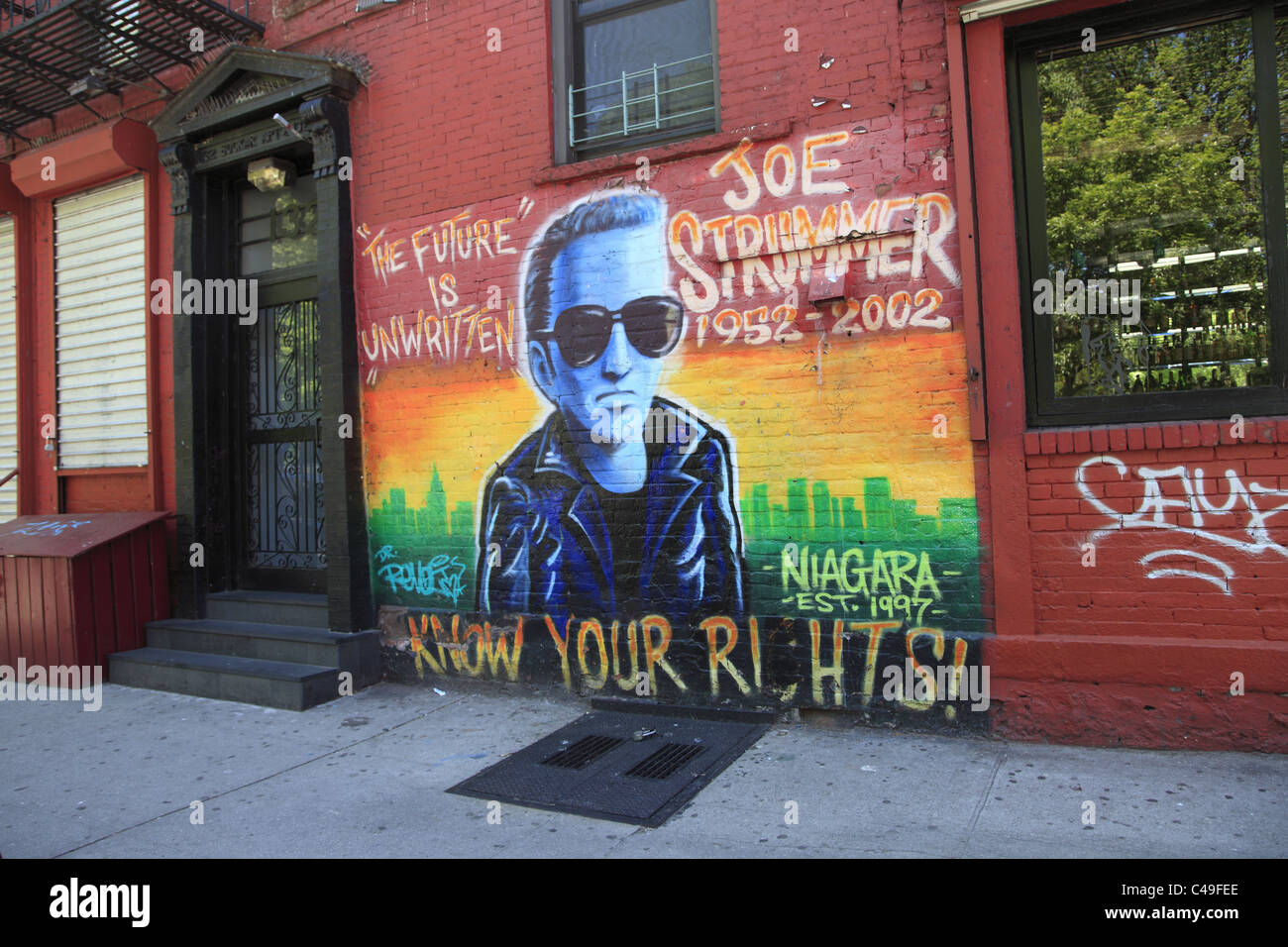 Memorial mural for Joe Strummer of The Clash on the wall of the Niagara Bar, East Village, Manhattan, New York City Stock Photo