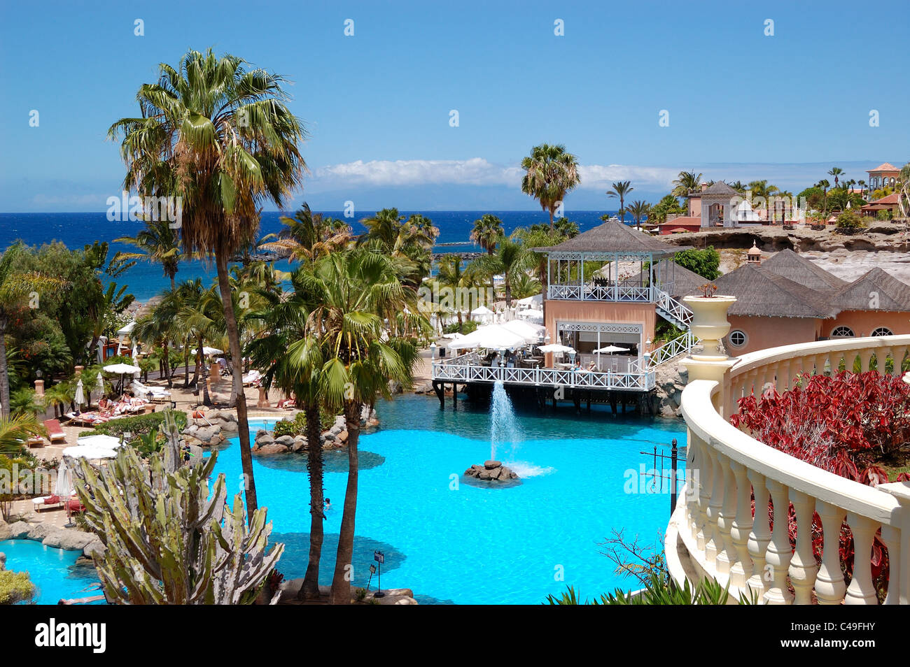 Swimming pool, open-air restaurant and beach of luxury hotel, Tenerife ...