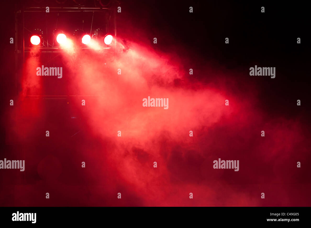 concert stage with red spot light and smoke Stock Photo