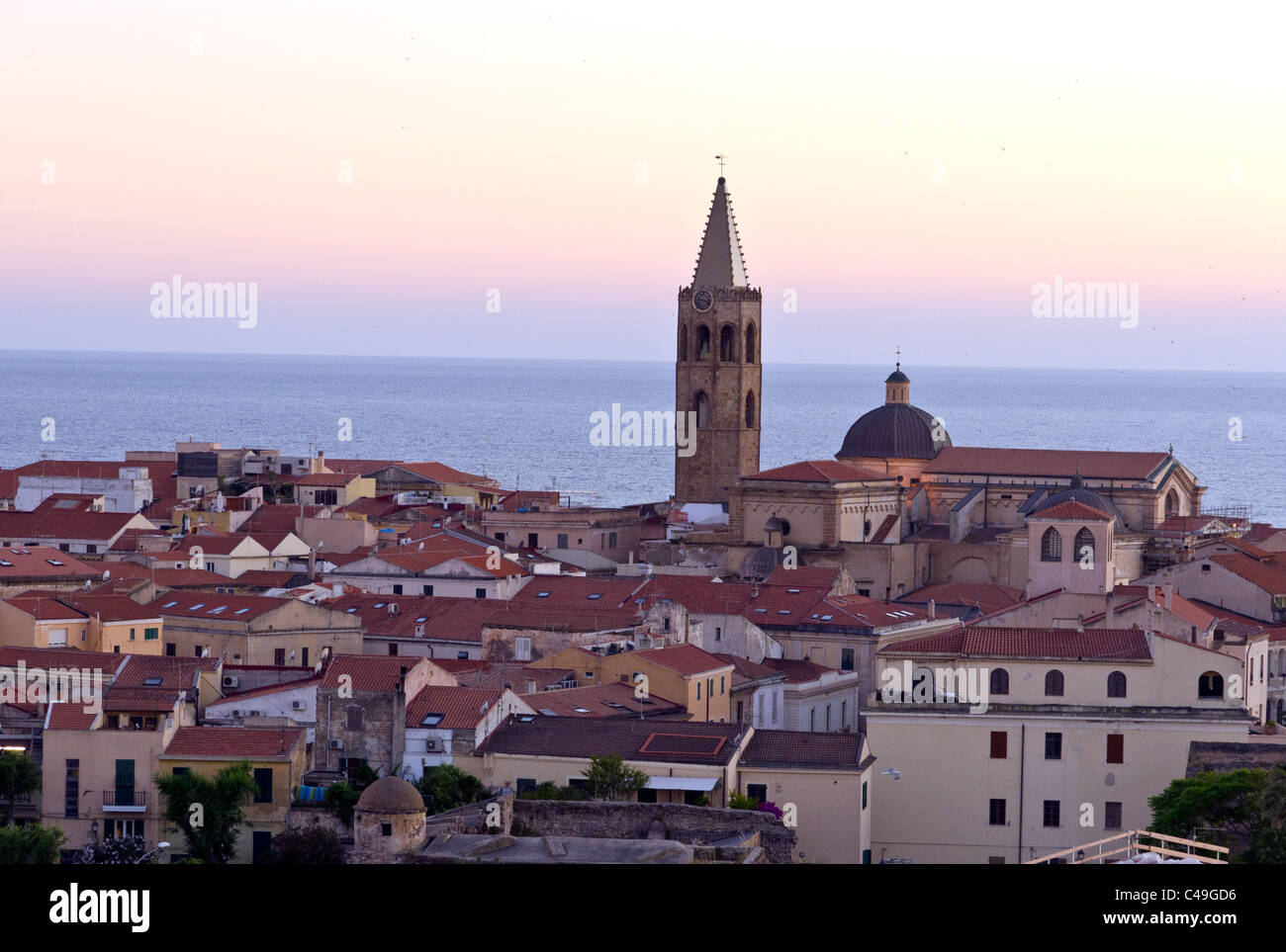 Alghero town and bell tower at sunset, Sardinia, Italy Stock Photo