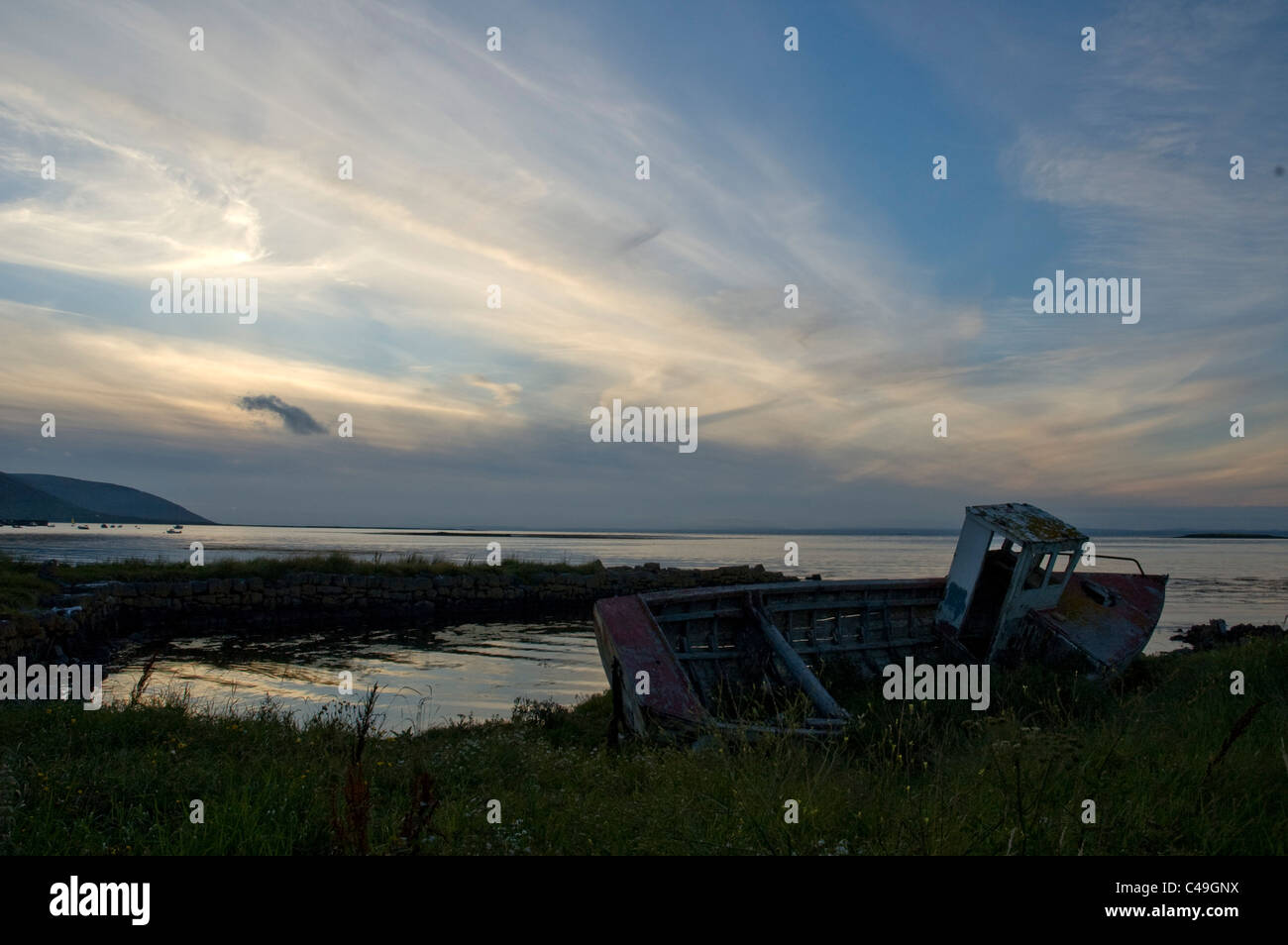 Photograph of a ship wreck on the coast of Ireland at sunset Stock Photo