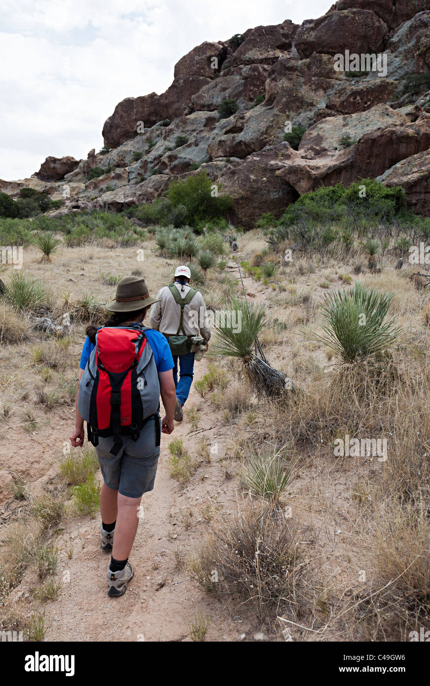 Walking on trail through Hueco Tanks State Historic Site Texas USA Stock Photo