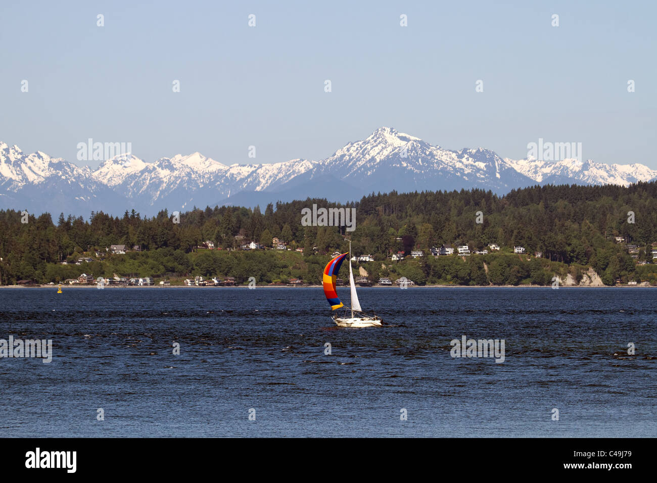 Colorful Sailboat on Puget Sound Olympic Peninsula Seattle Wasington Stock Photo