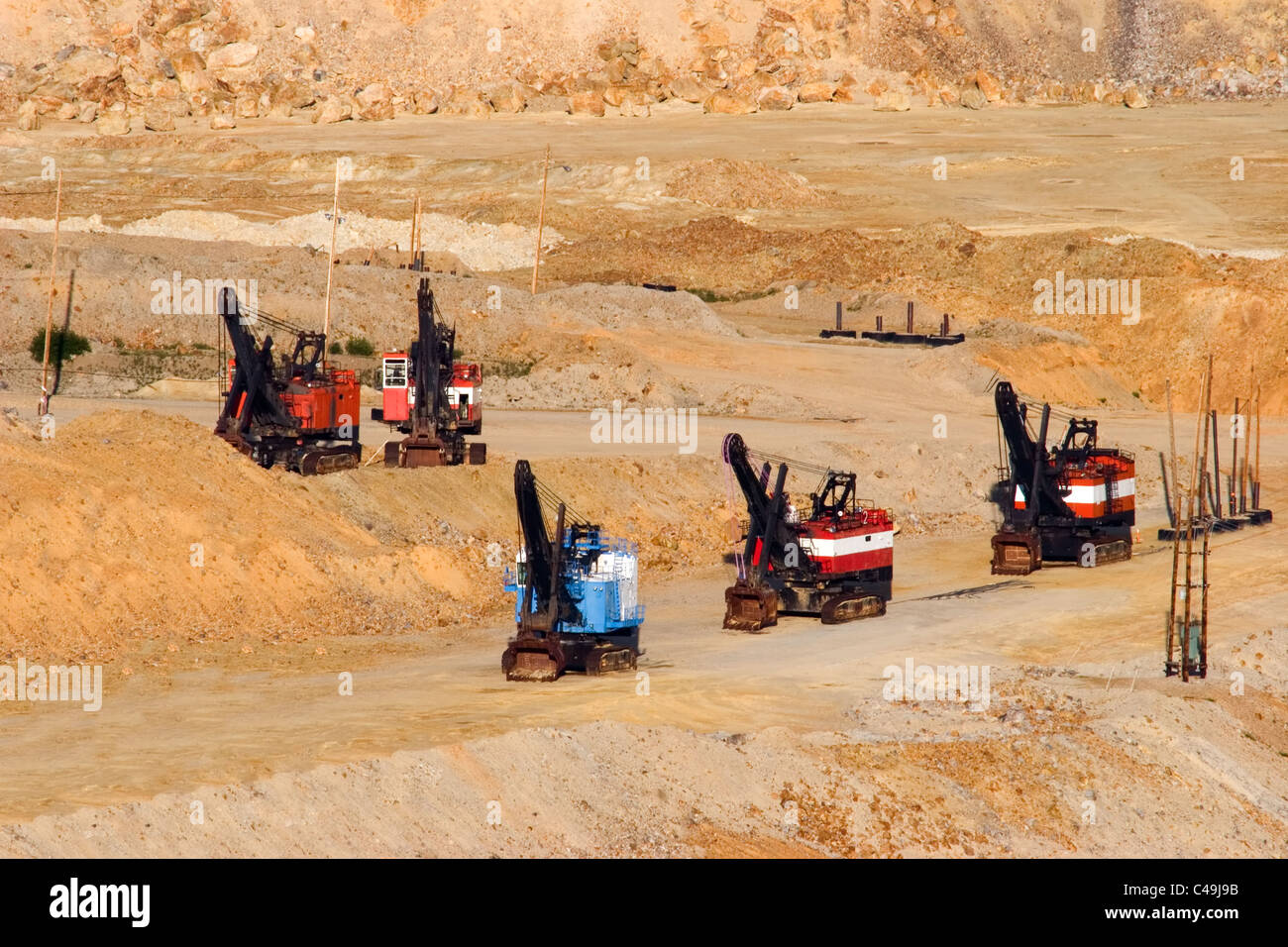 A series of excavators at a molybdenum mine Stock Photo