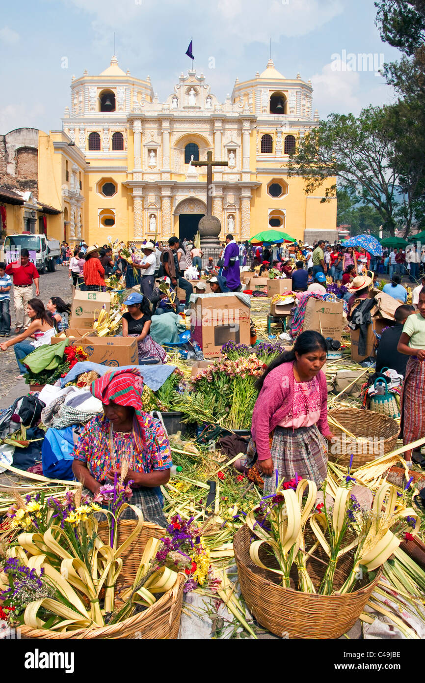 Mayan women hand-crafting palms in front of ( church in Antigua to be sold for Holy Week (Semana Santa) Stock Photo