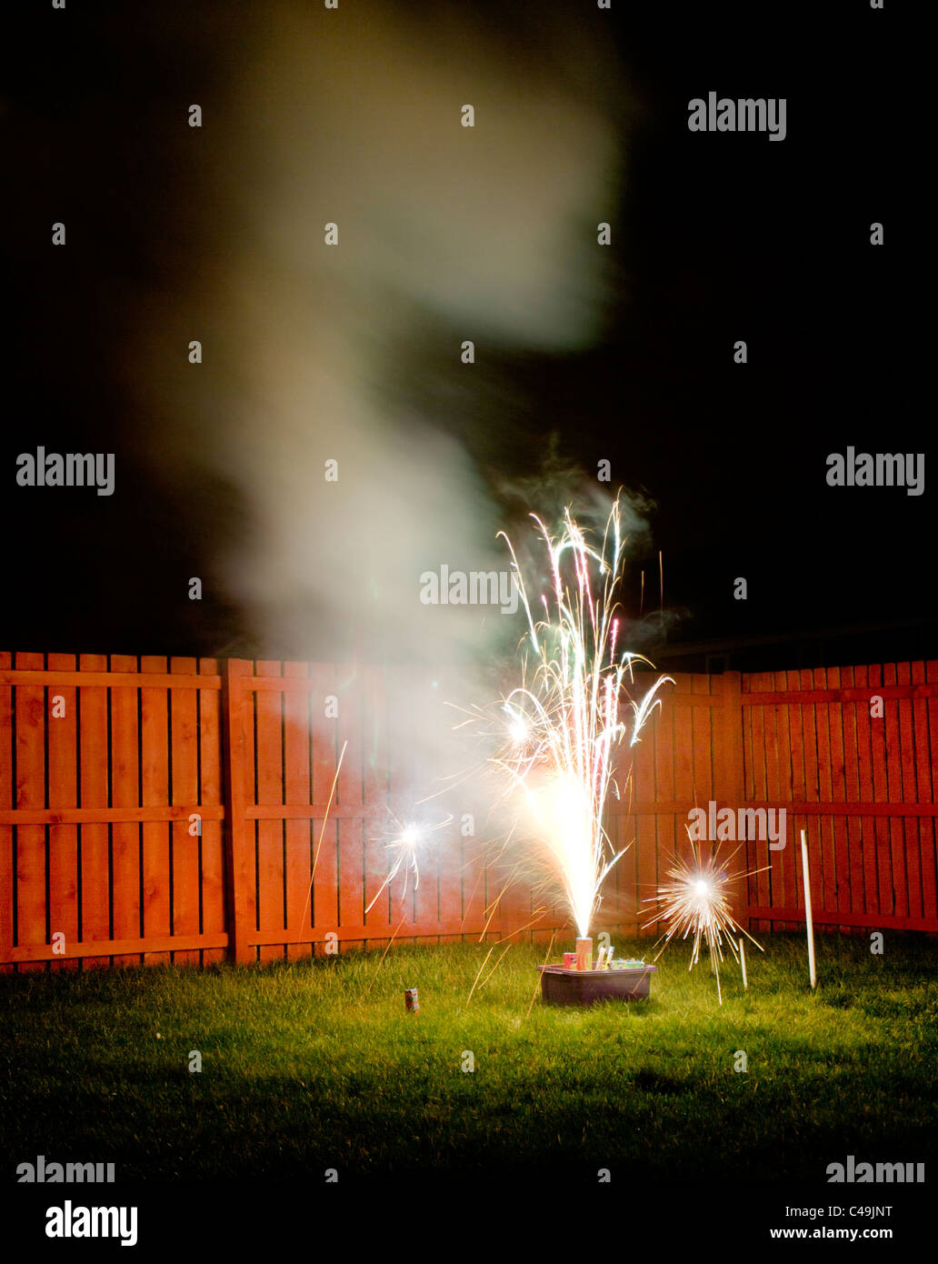 Fireworks in a back garden Stock Photo Alamy