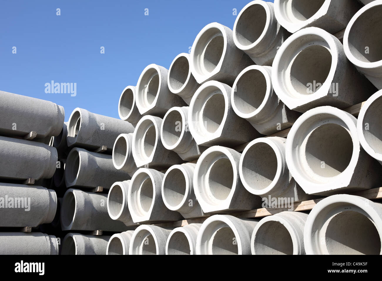 Concrete water pipes stacked in rows Stock Photo Alamy