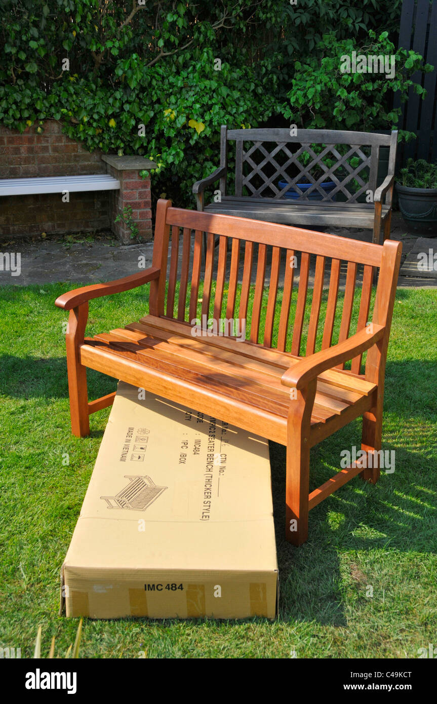 Imported DIY assembled hardwood self assembly flat pack garden seat & empty cardboard packaging box which contained all the components England UK Stock Photo