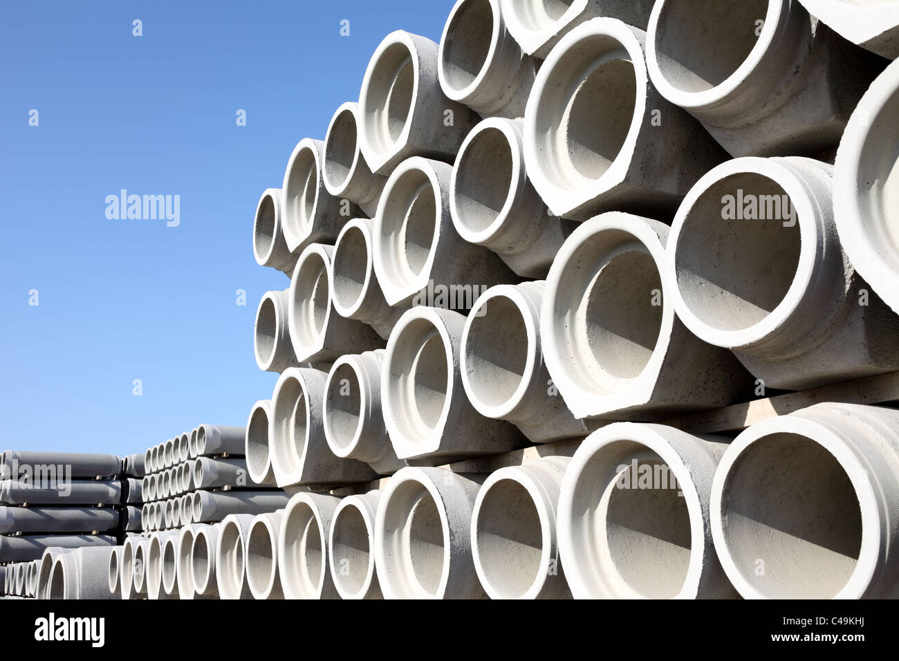 Concrete water pipes stacked in rows Stock Photo Alamy