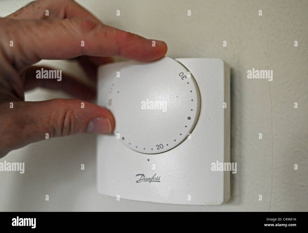 Adjusting the heating thermostat for your home central heating . energy