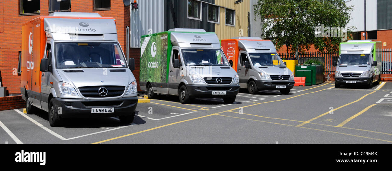 Ocado online home shopping groceries delivery vans parked at London warehouse van depot England UK Stock Photo