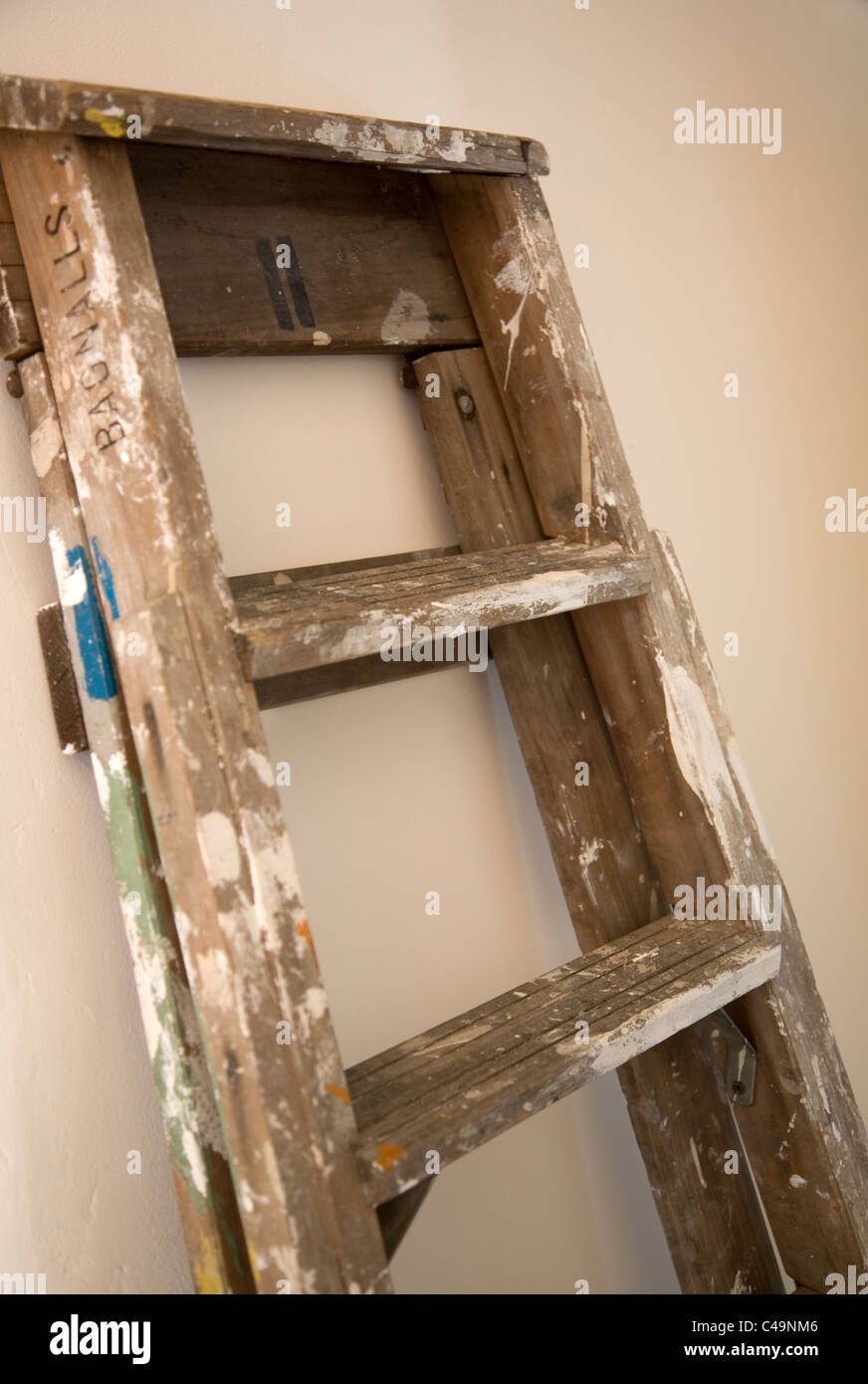 Ladder leaning against wall Stock Photo