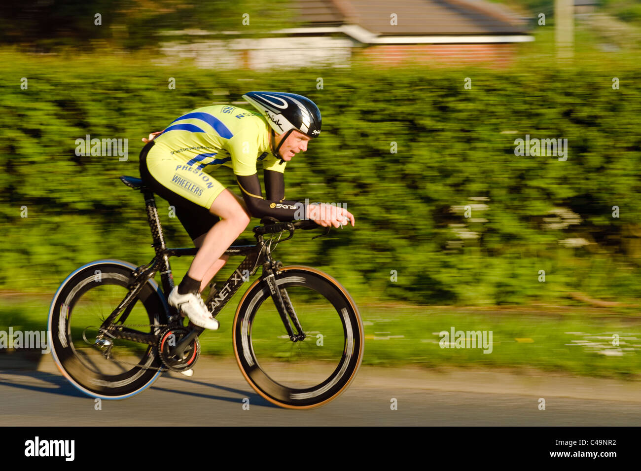 Cyclist in time trial race near Preston, Lancashire, England Stock Photo