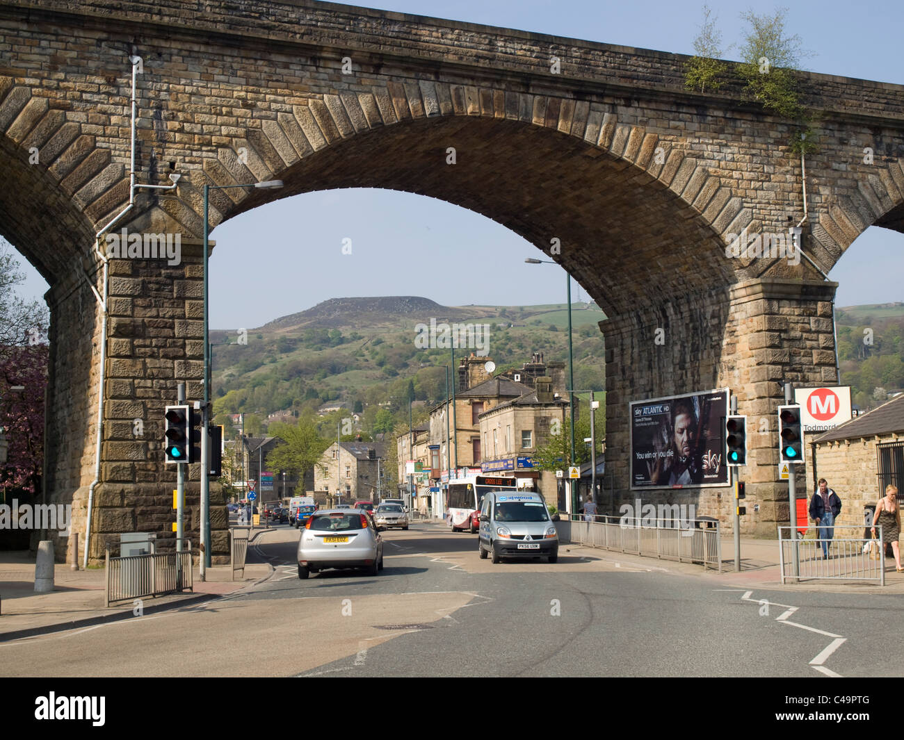 The A646 Burnley Road leading out of Todmorden, under the railway