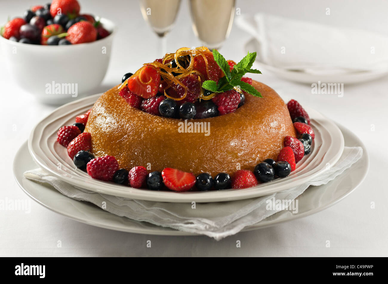 Savarin with fruit. Traditional dessert Stock Photo - Alamy