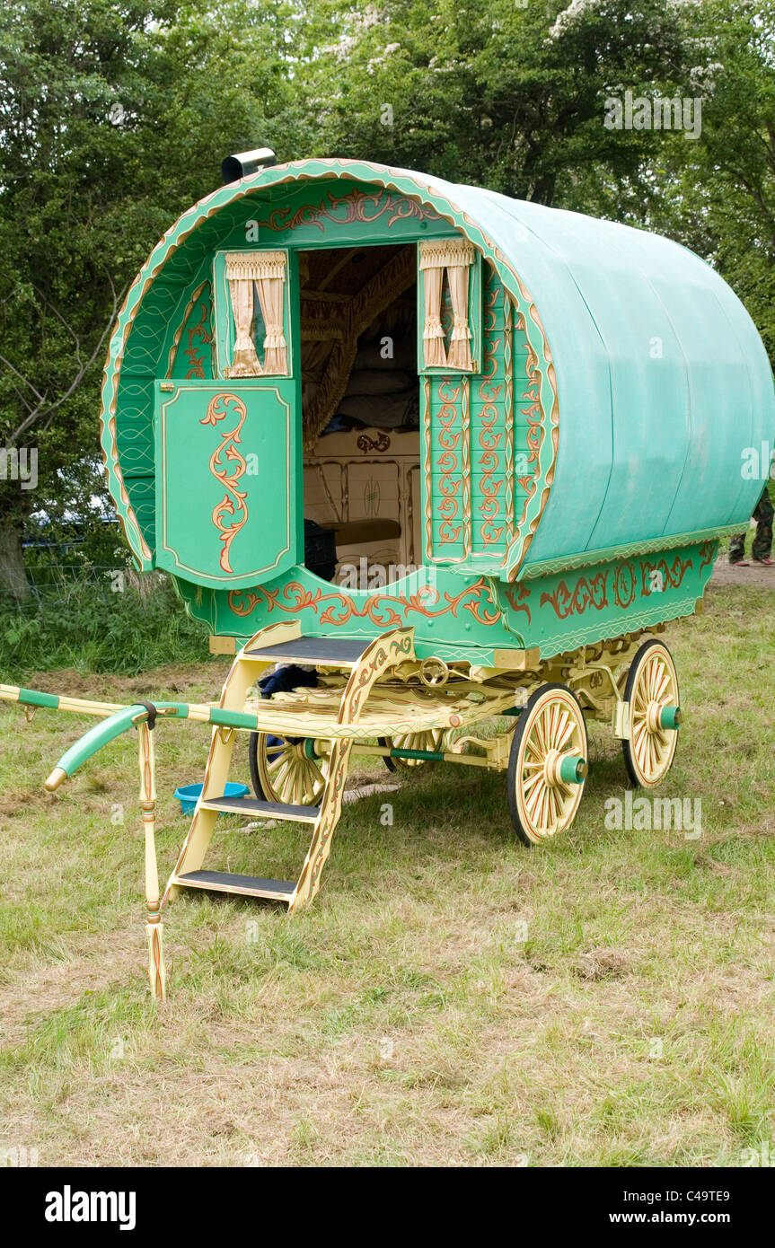 gypsy caravan caravans traditional wood wooden wheel wheels horse drawn traveler travelers  Gypsies Stock Photo