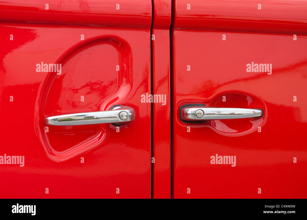 double car handles of a red vintage volkswagen bus Stock Photo