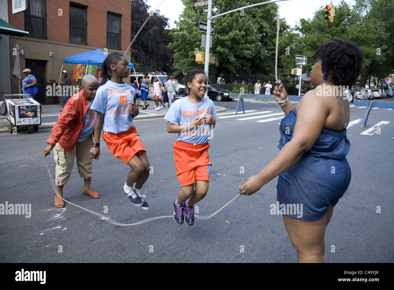 Practicing Double Dutch (jump rope) on the street in Brooklyn during