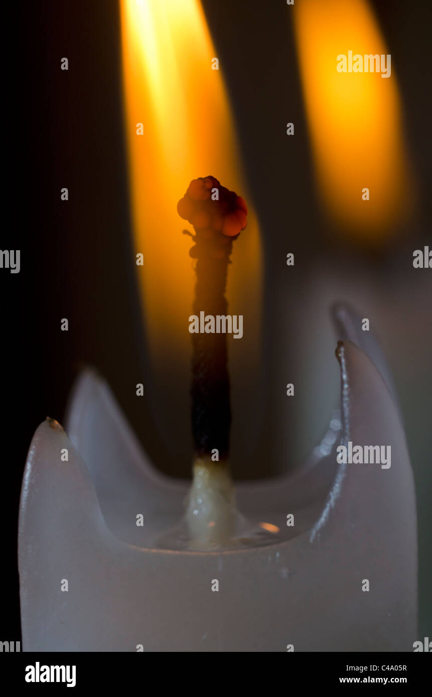 Close up of burning candle Stock Photo - Alamy