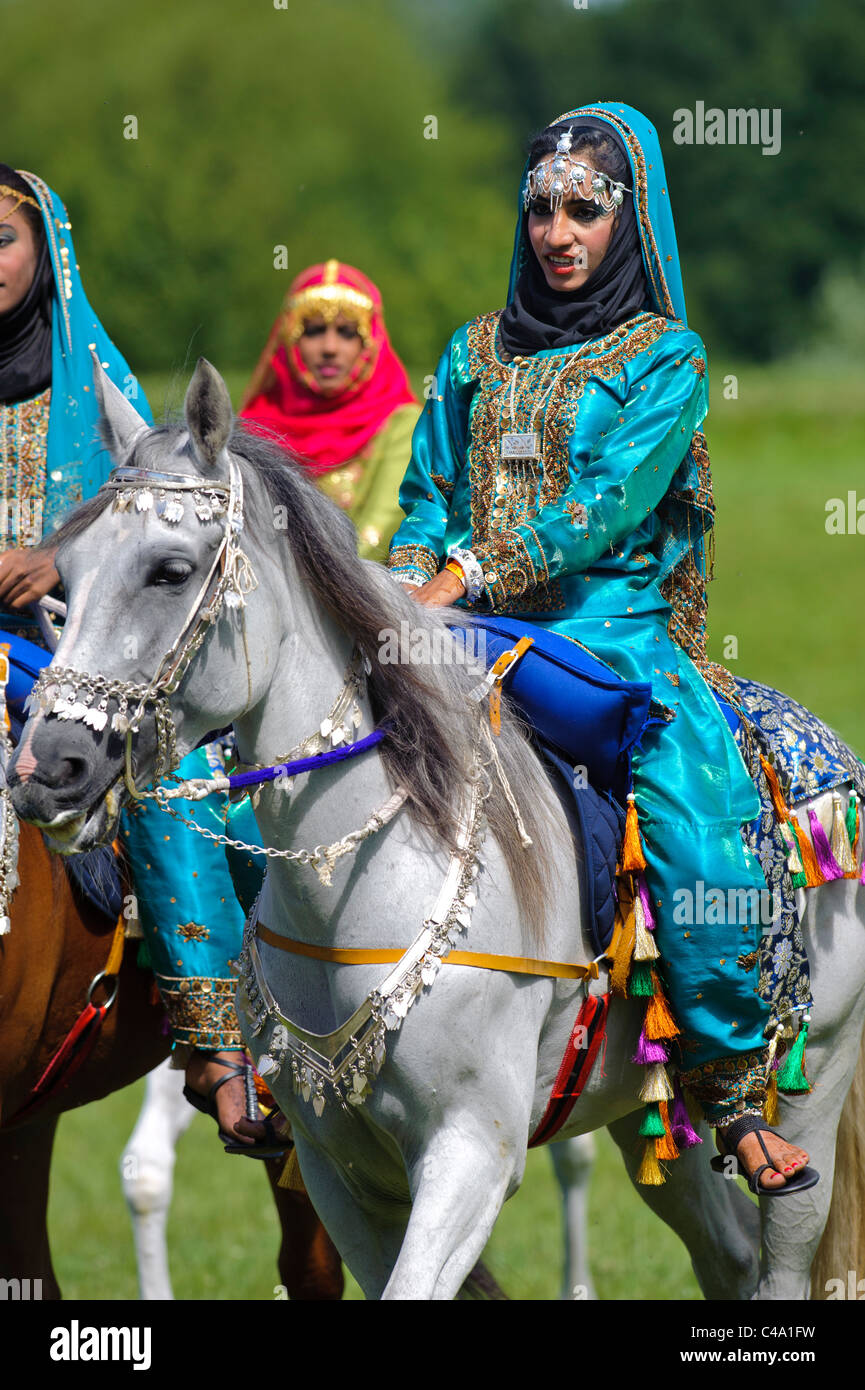 arabian Royal Cavalry of Oman in original costume on arabic horse while a public show