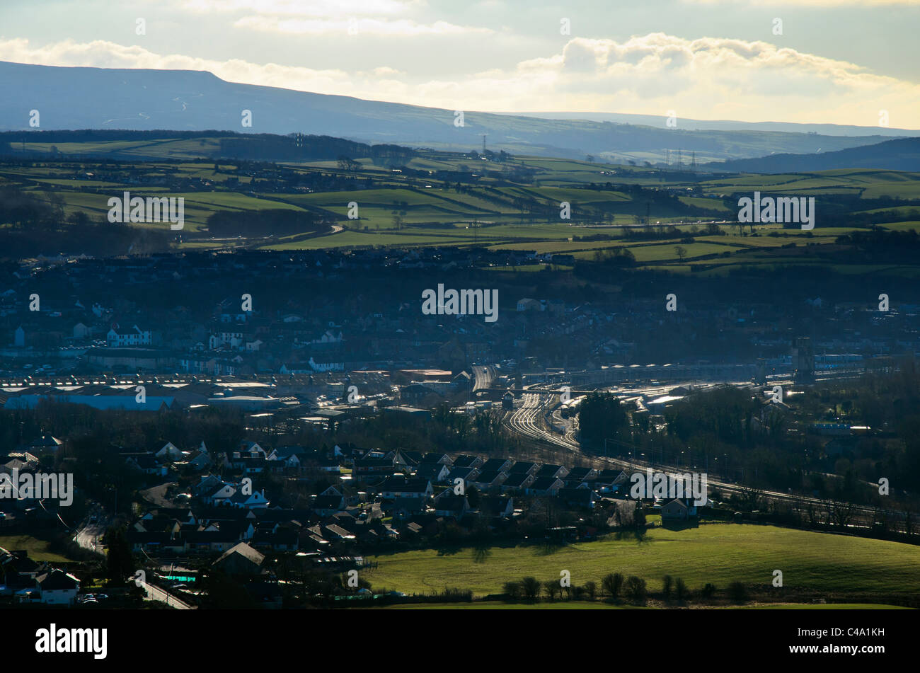 The town of Carnforth in North Lancashire. On the skyline is Clougha Pike in the Bowland Fells Stock Photo