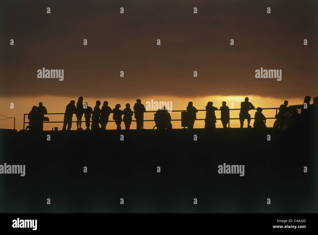 Photograph of people watching the sunset in the United States of America Stock Photo