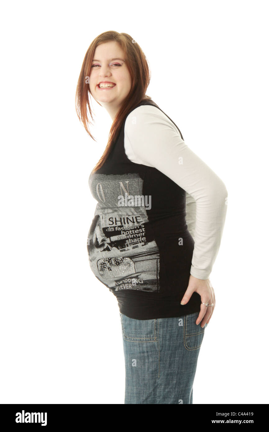 Casual portrait of a young woman, nine months pregnant, in casual attire. Stock Photo