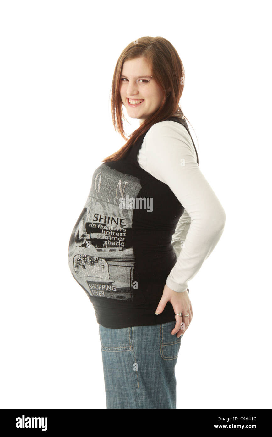 Casual portrait of a young woman, nine months pregnant, in casual attire. Stock Photo